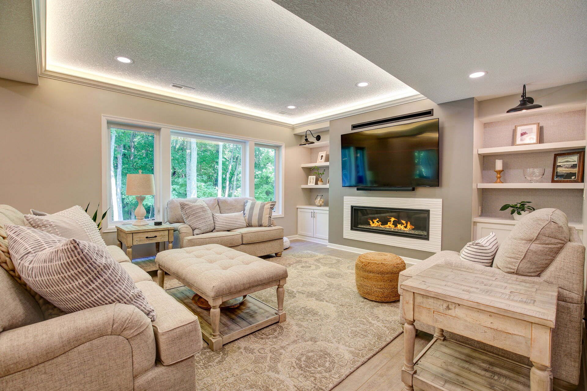 Basement finish in Prior Lake with gas fireplace and custom lighting